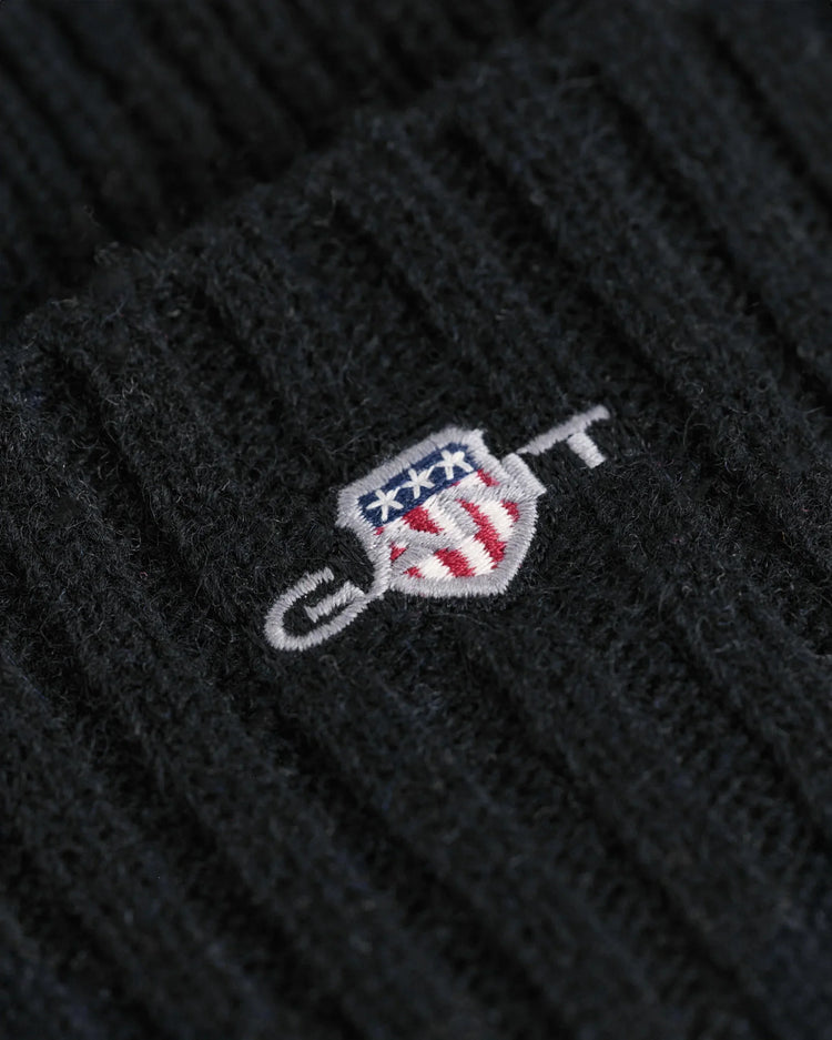 GANT herr mössa i svart ribbstickad ull med broderad logotypdetalj