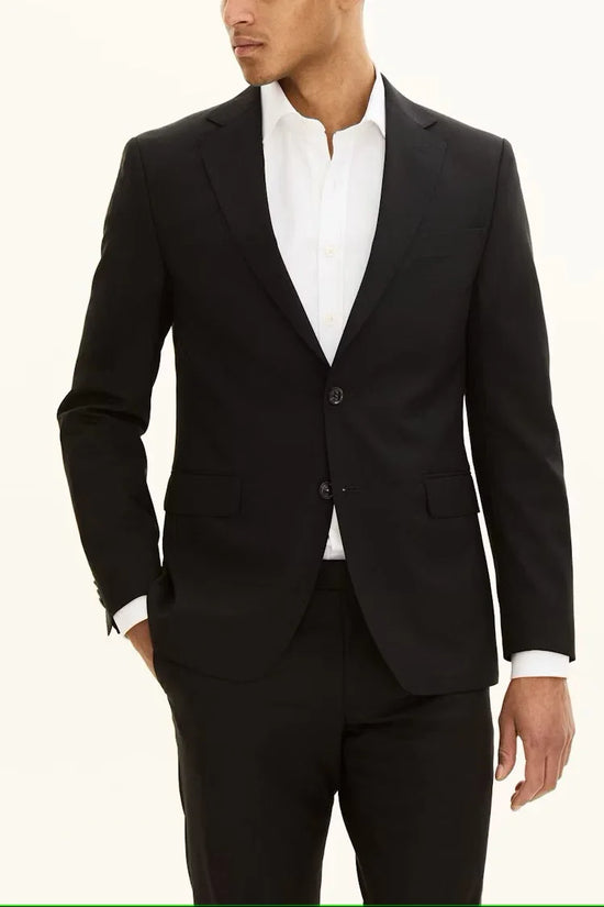 Herr i svart kavaj och vita skjorta, klassisk stil, elegant herrmode