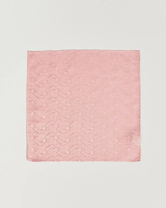 Rosa näsduk i siden med diskret paisleymönster, elegant herraccessoar.