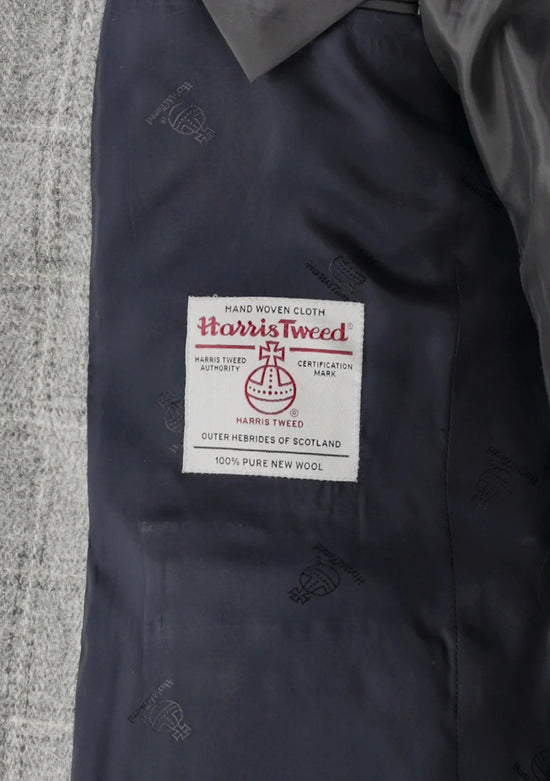 Närbild på Harris Tweed-certifiering i grå herrkavaj, 100% ull, hög kvalitet