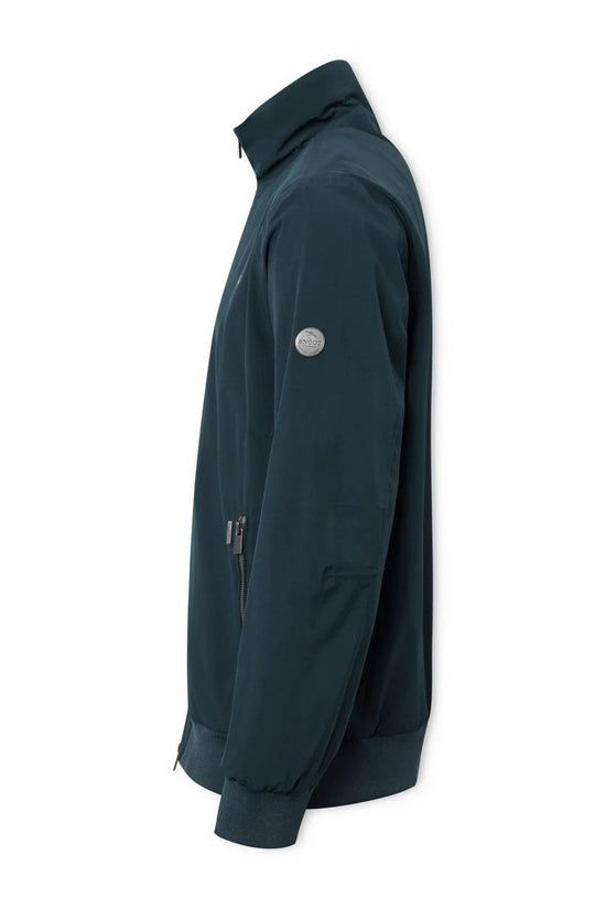 Mörkblå herrjacka med ståkrage, dragkedja och ribbade muddar, visad från sidan.