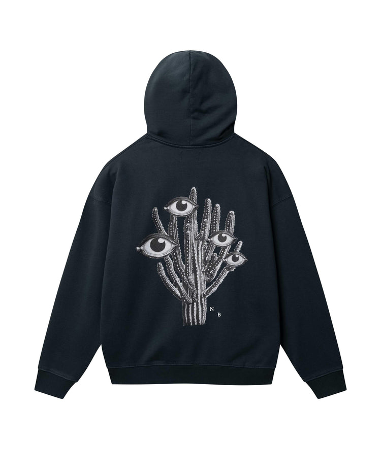 Desert Trip Boxy Hood svart hoodie med grafiskt kaktusmotiv och ögon bak