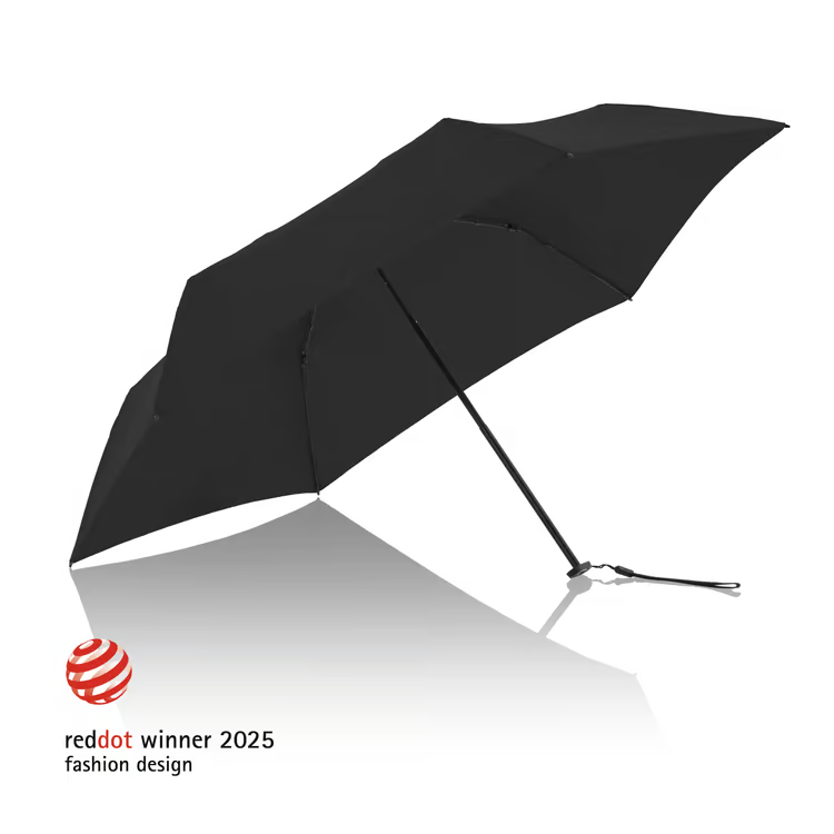 Svart paraply med röd dot award 2025, fashion design