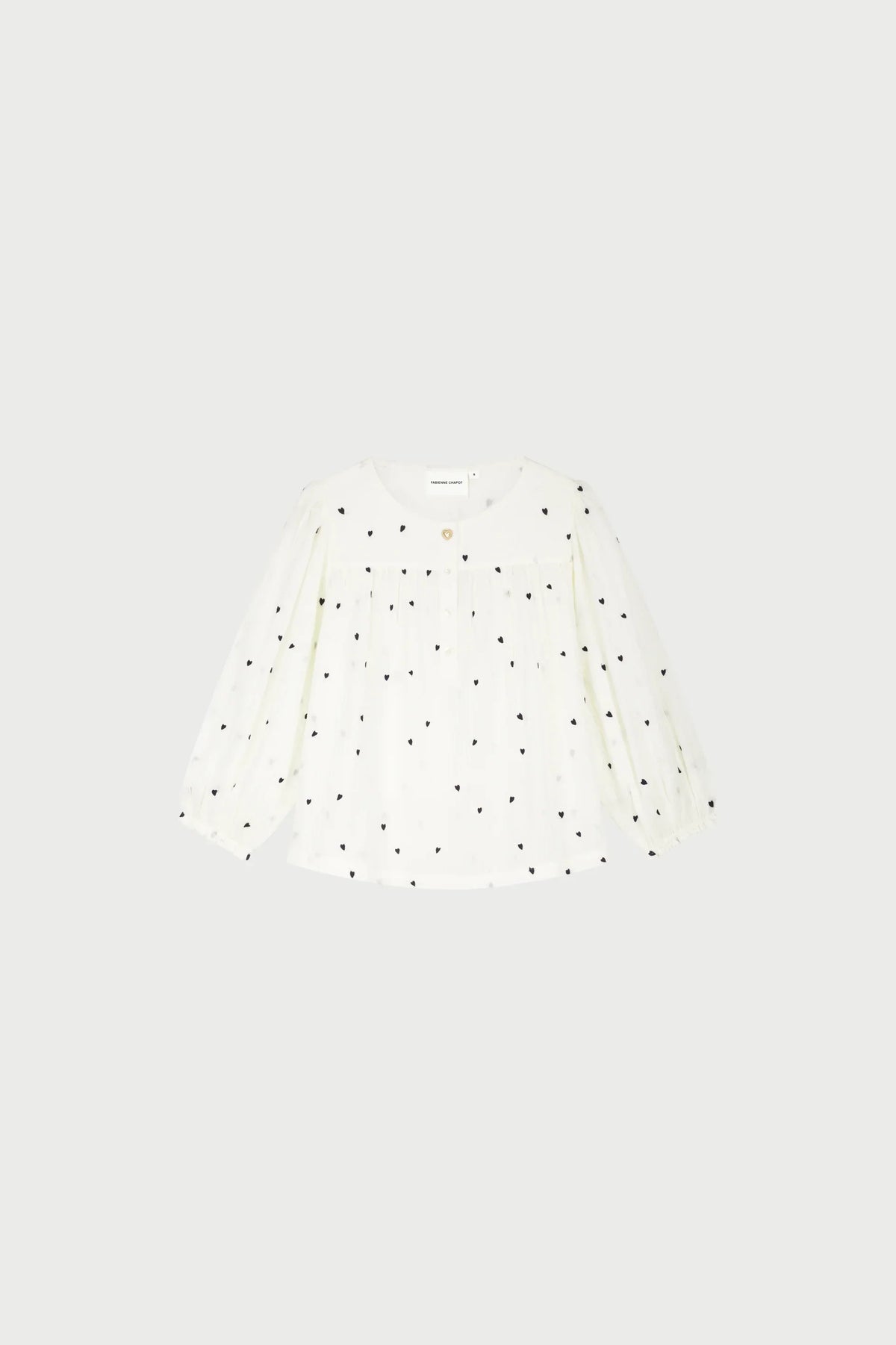 Bindi Top vit blus med svarta hjärtmönster och lång ärm