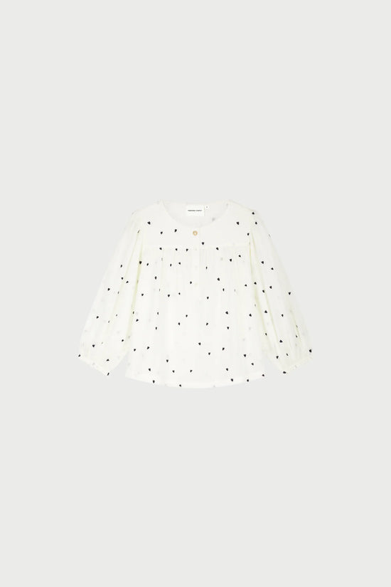 Bindi Top vit blus med svarta hjärtmönster och lång ärm