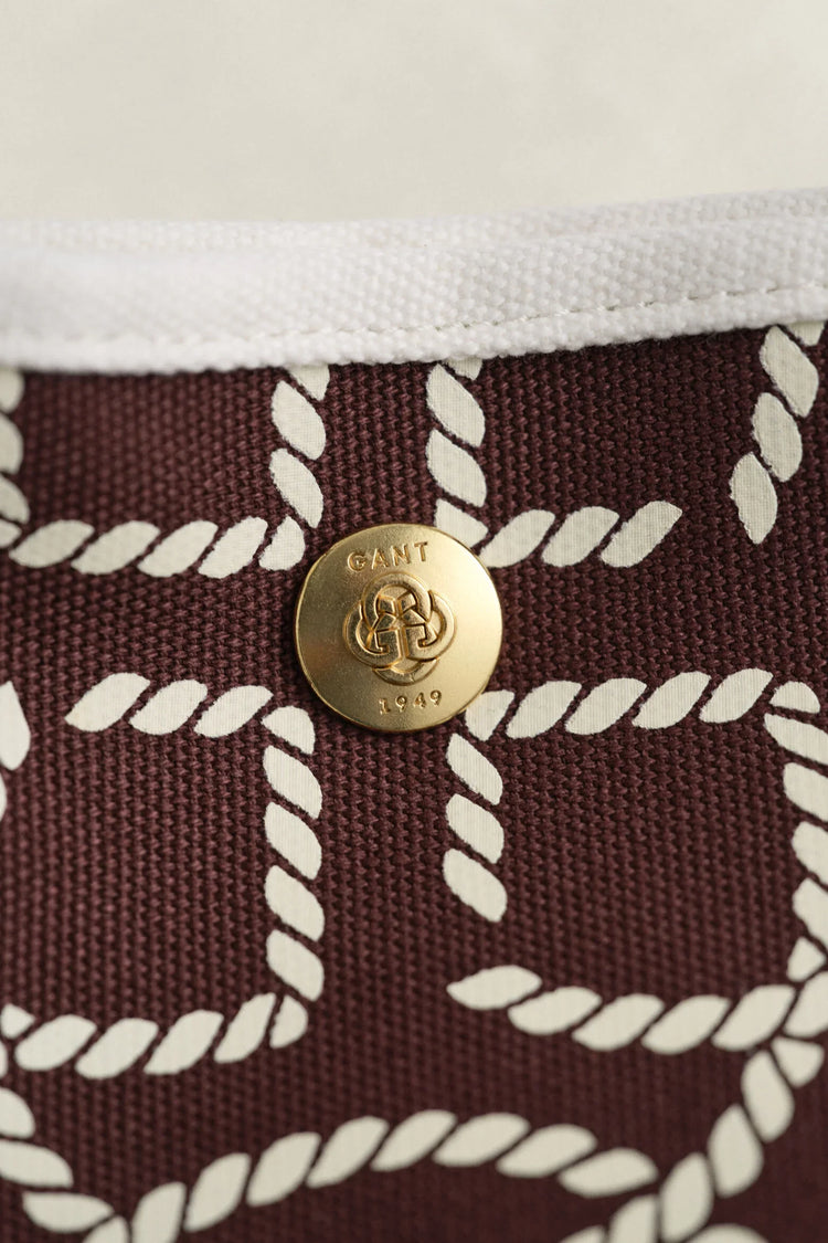 Gant accessoar bordeaux mönstrad tygdetalj och guldfärgad knapp