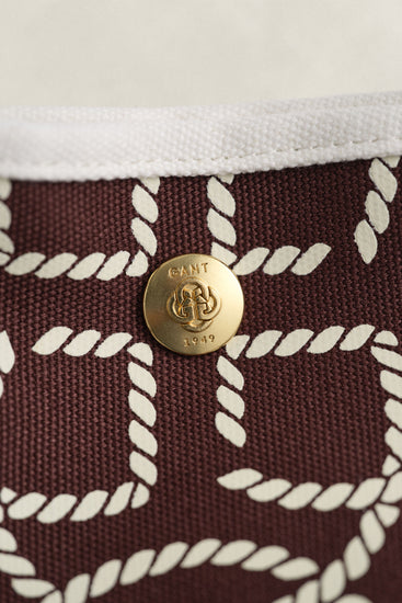 Gant accessoar bordeaux mönstrad tygdetalj och guldfärgad knapp